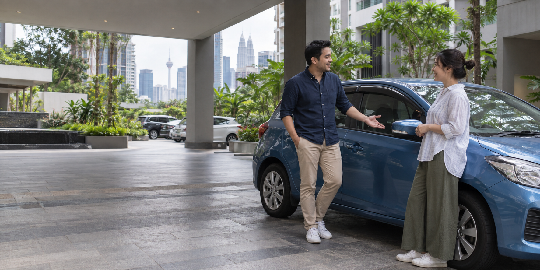 Two Malaysians discussing peer-to-peer car sharing beside a car in a Kuala Lumpur neighbourhood